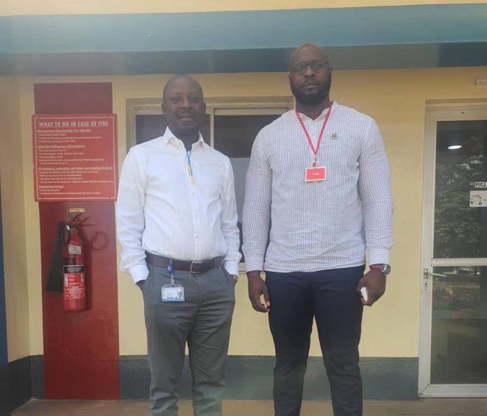 Mr. Adeojo (left), and the Manager, Nigerian Breweries ltd.